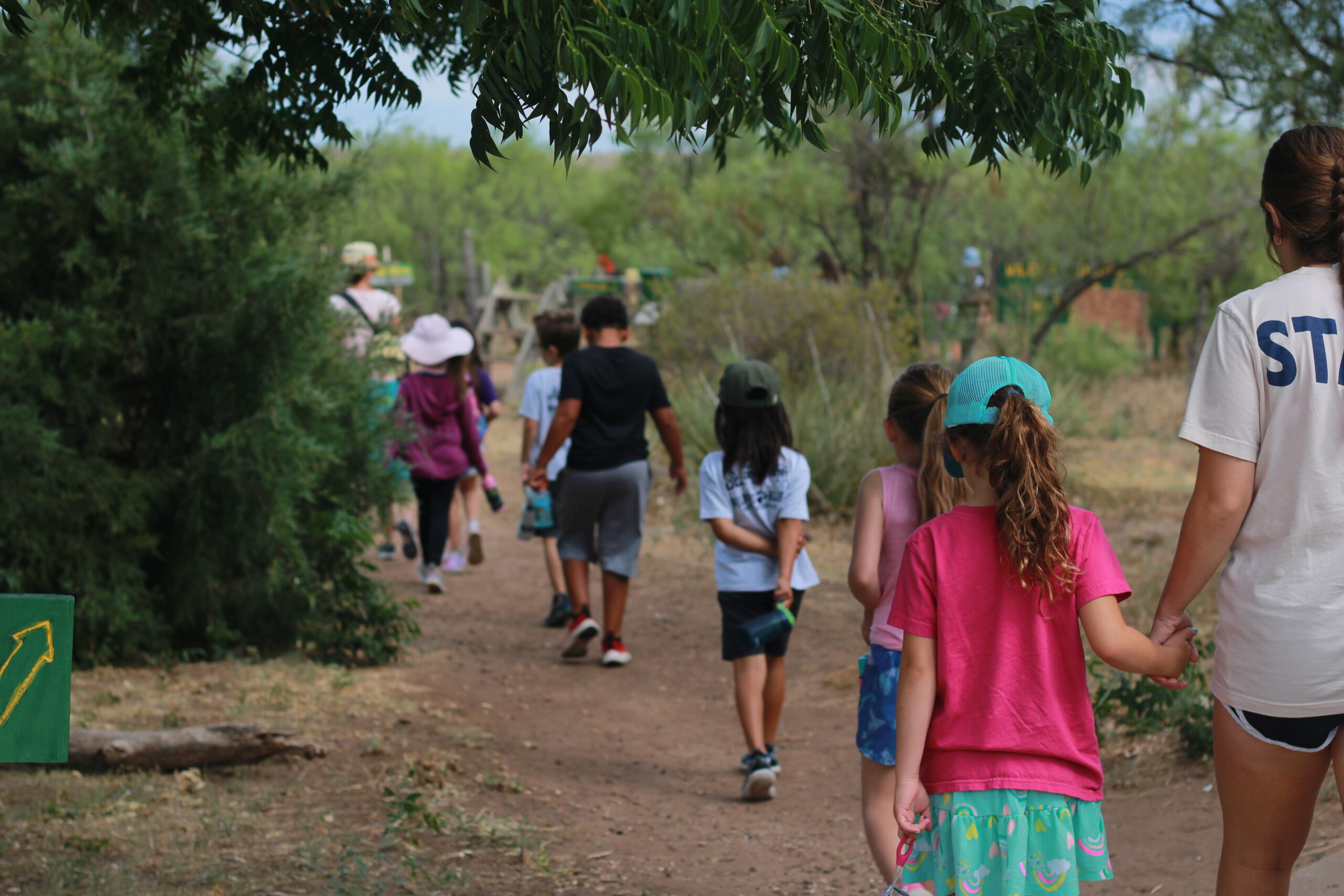 Campers on a hike through the Gnarly Mesquite Trail at Wildcat Bluff, Amarillo, Texas