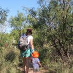 Toddler Tracks attendees hiking on teh wild kitten loop trail at Wildcat Bluff Nature Center, Amarillo, Texas
