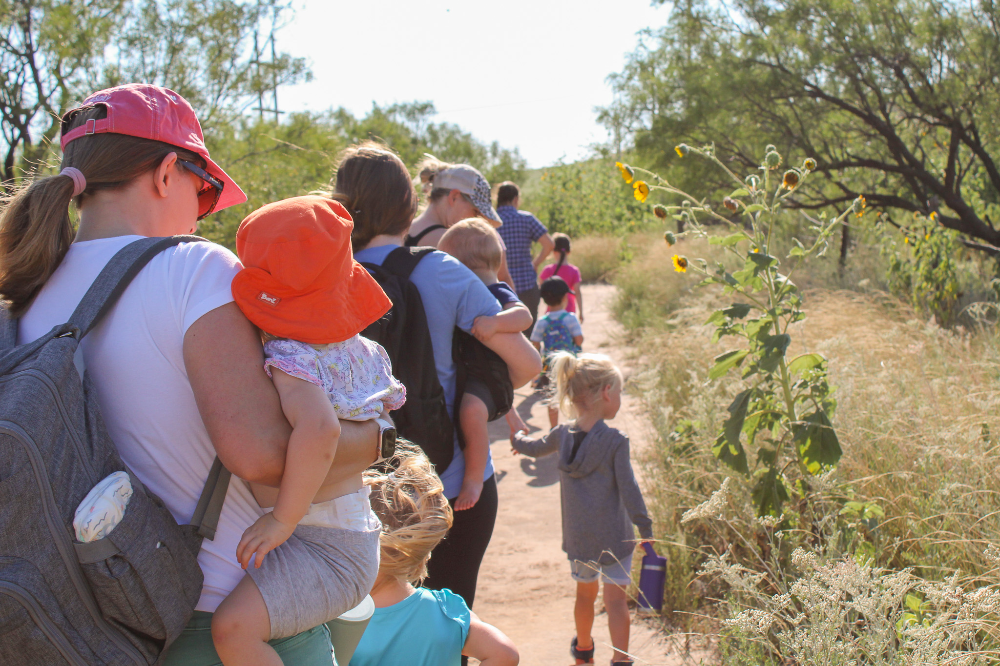 Toddler Tracks attendees hiking on teh wild kitten loop trail at Wildcat Bluff Nature Center, Amarillo, Texas