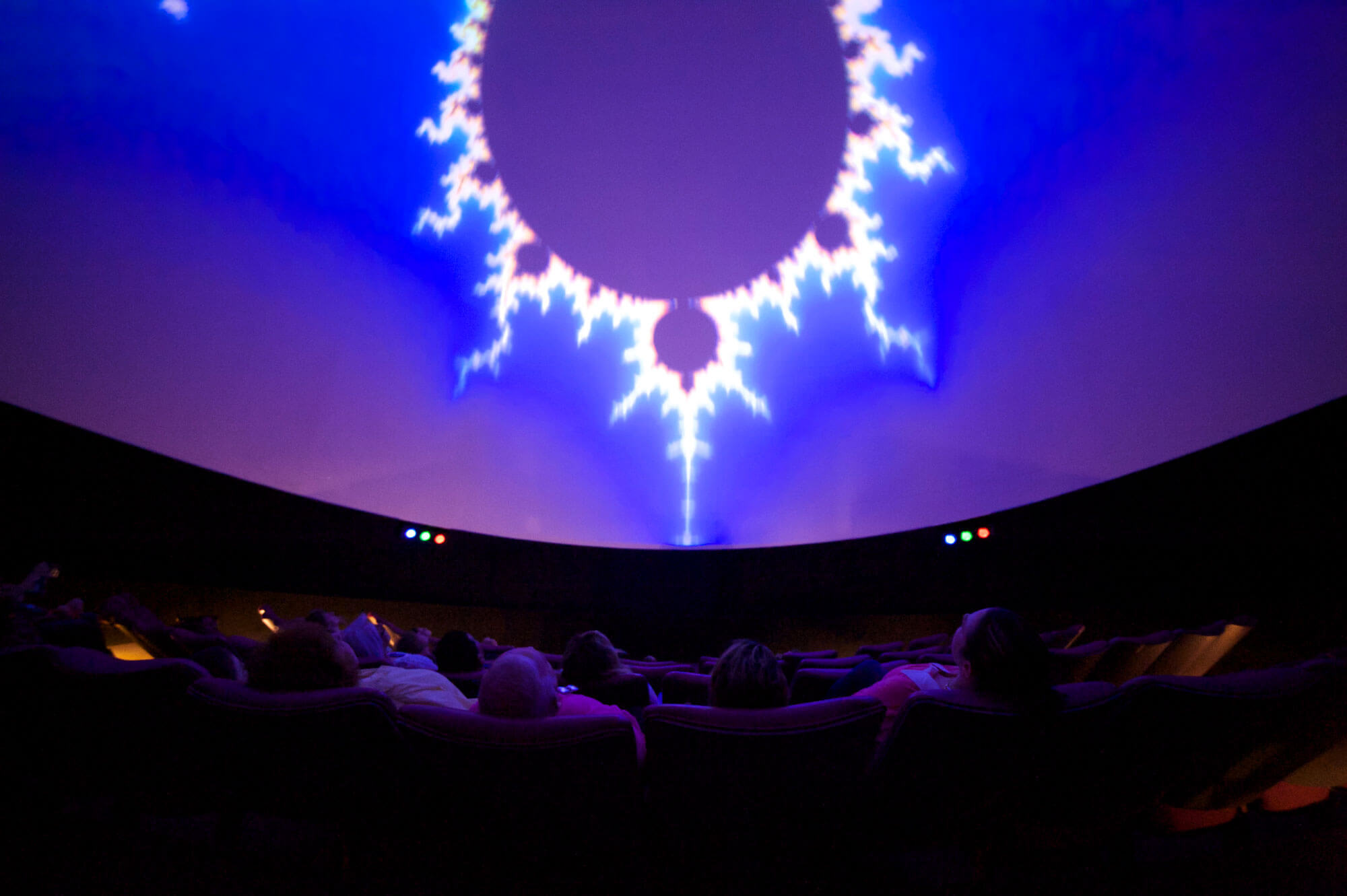 people sitting in a space theater